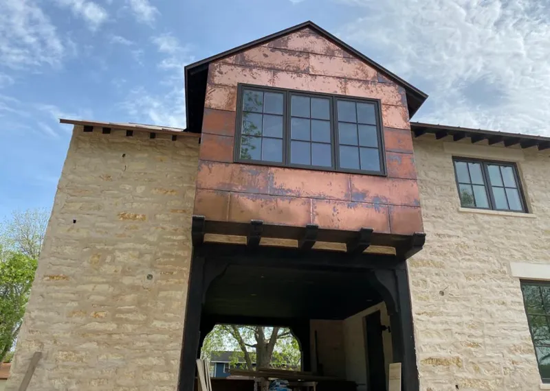 Copper metal panel facade on a stone building for Metal Roof Coating in Brooksville