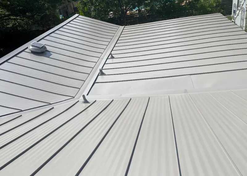 Solar attic fan installed on a metal roof for Roof Ventilation in Brooksville